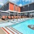 swimming pool with modern design, ample seating and nearness to property apartment homes