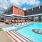 swimming pool with modern design, ample seating and nearness to property apartment homes