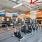 fitness center with ample equipment and in a large, spacious room